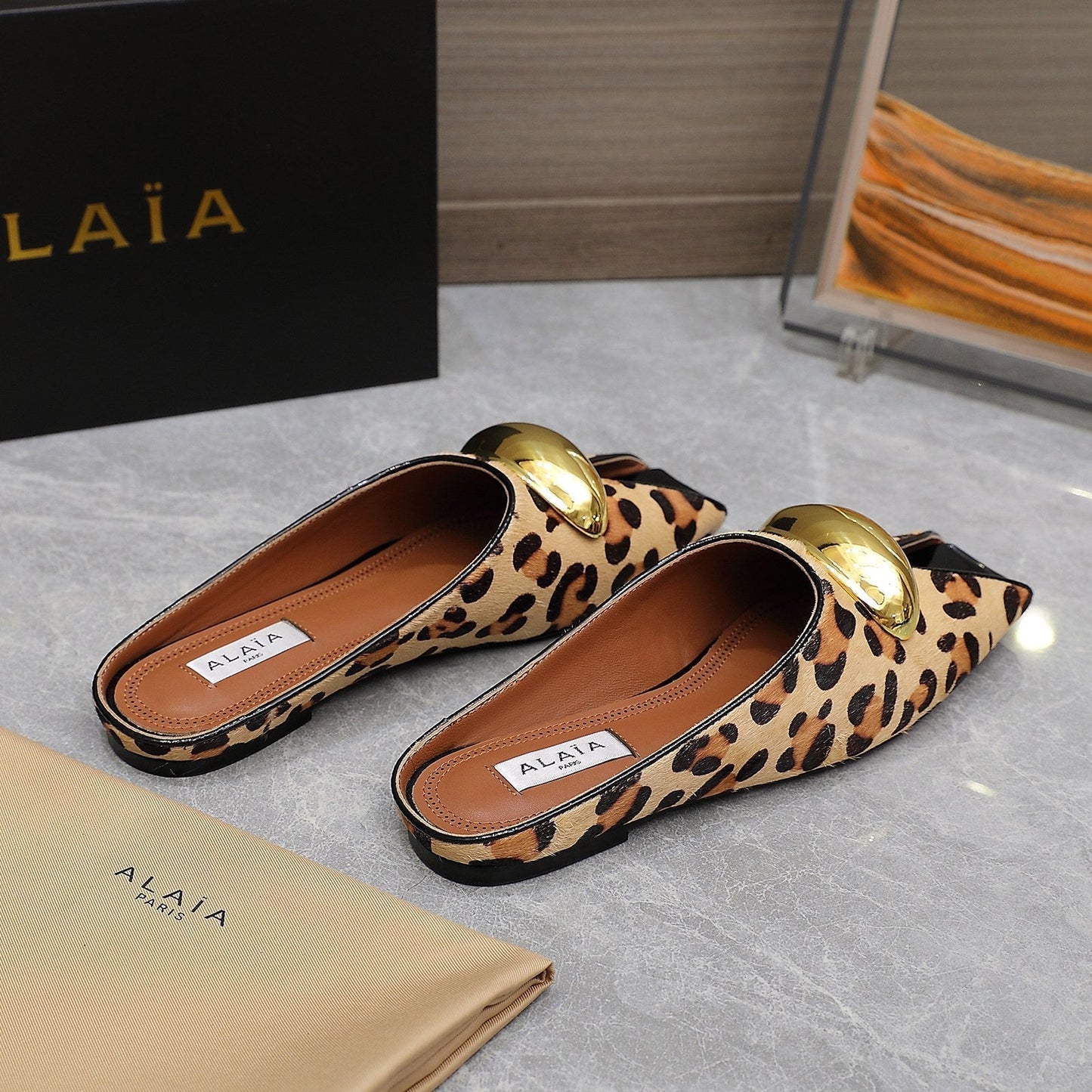 ALAIA FLAT MULE IN LEOPARD LAMBSKIN WITH GOLD HARDWARE - 34