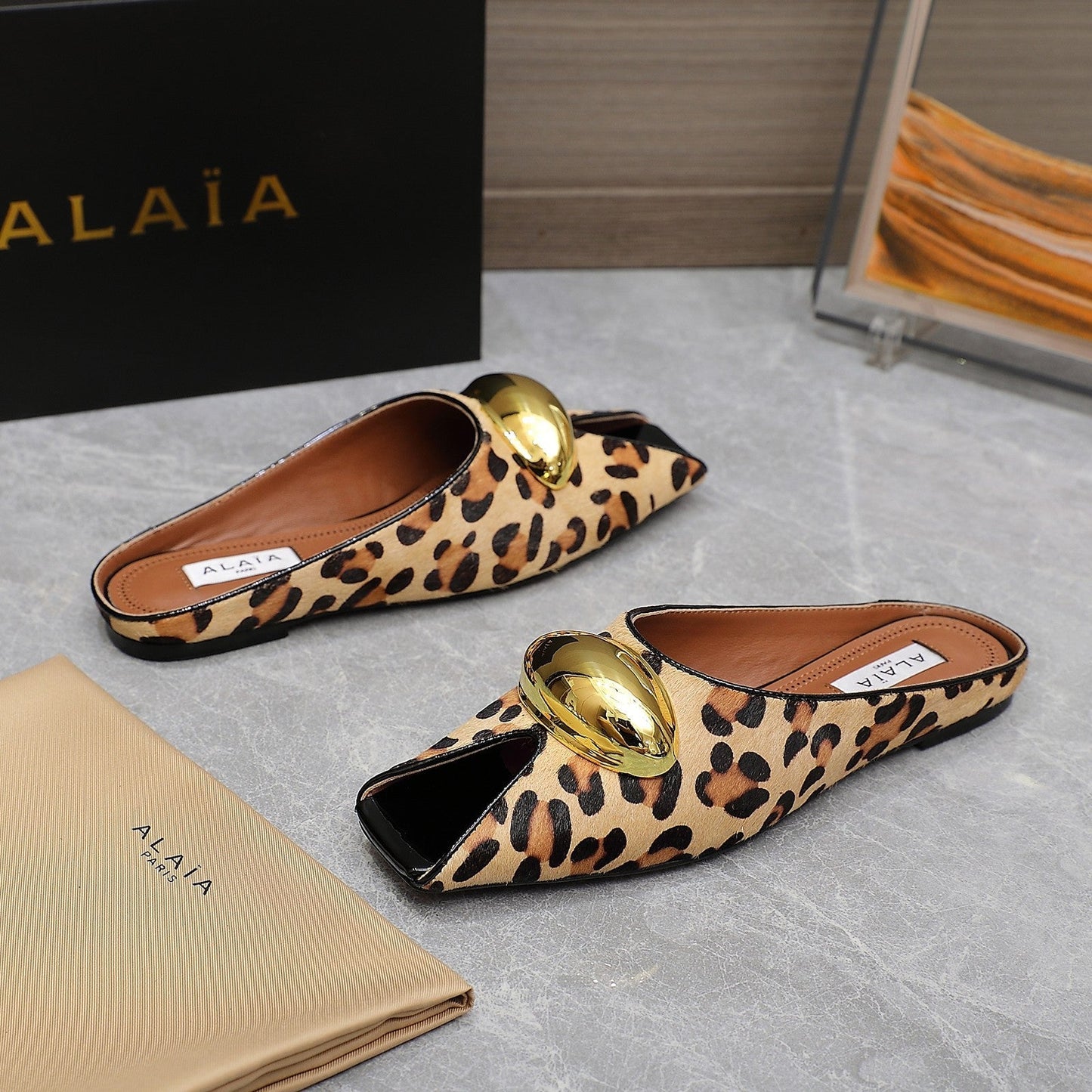 ALAIA FLAT MULE IN LEOPARD LAMBSKIN WITH GOLD HARDWARE - 34