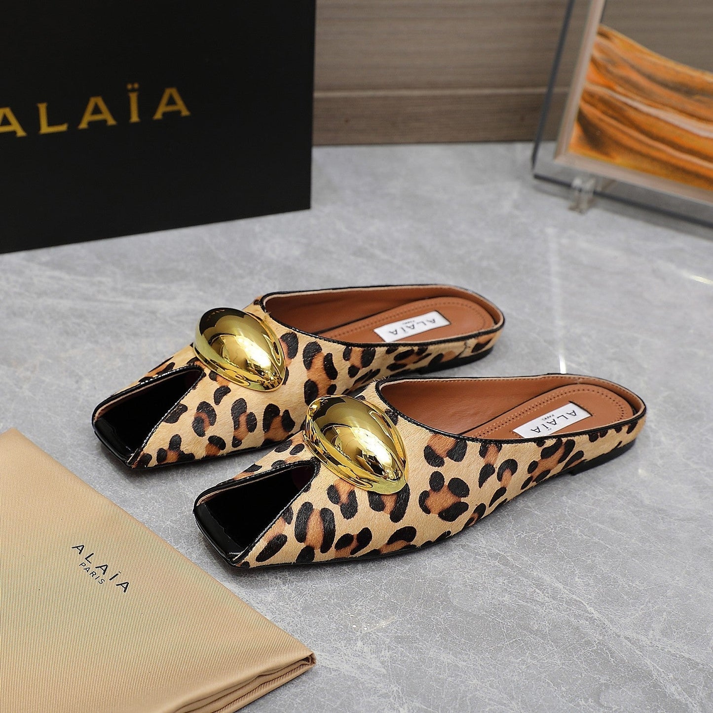 ALAIA FLAT MULE IN LEOPARD LAMBSKIN WITH GOLD HARDWARE - 34
