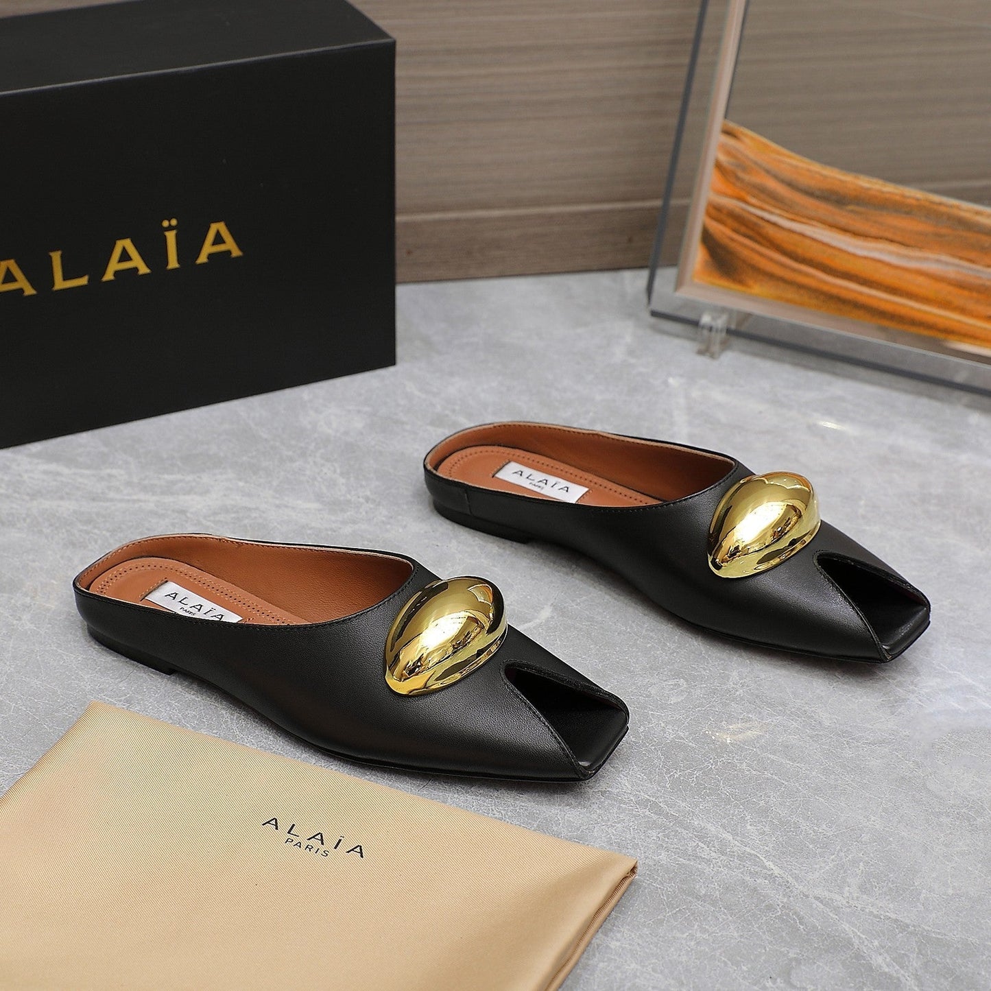 ALAIA FLAT MULE IN BLACK LAMBSKIN WITH GOLD HARDWARE - 34