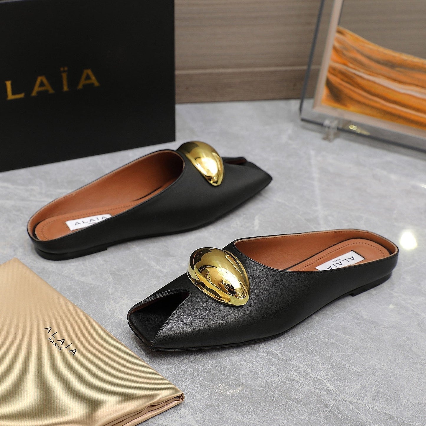 ALAIA FLAT MULE IN BLACK LAMBSKIN WITH GOLD HARDWARE - 34