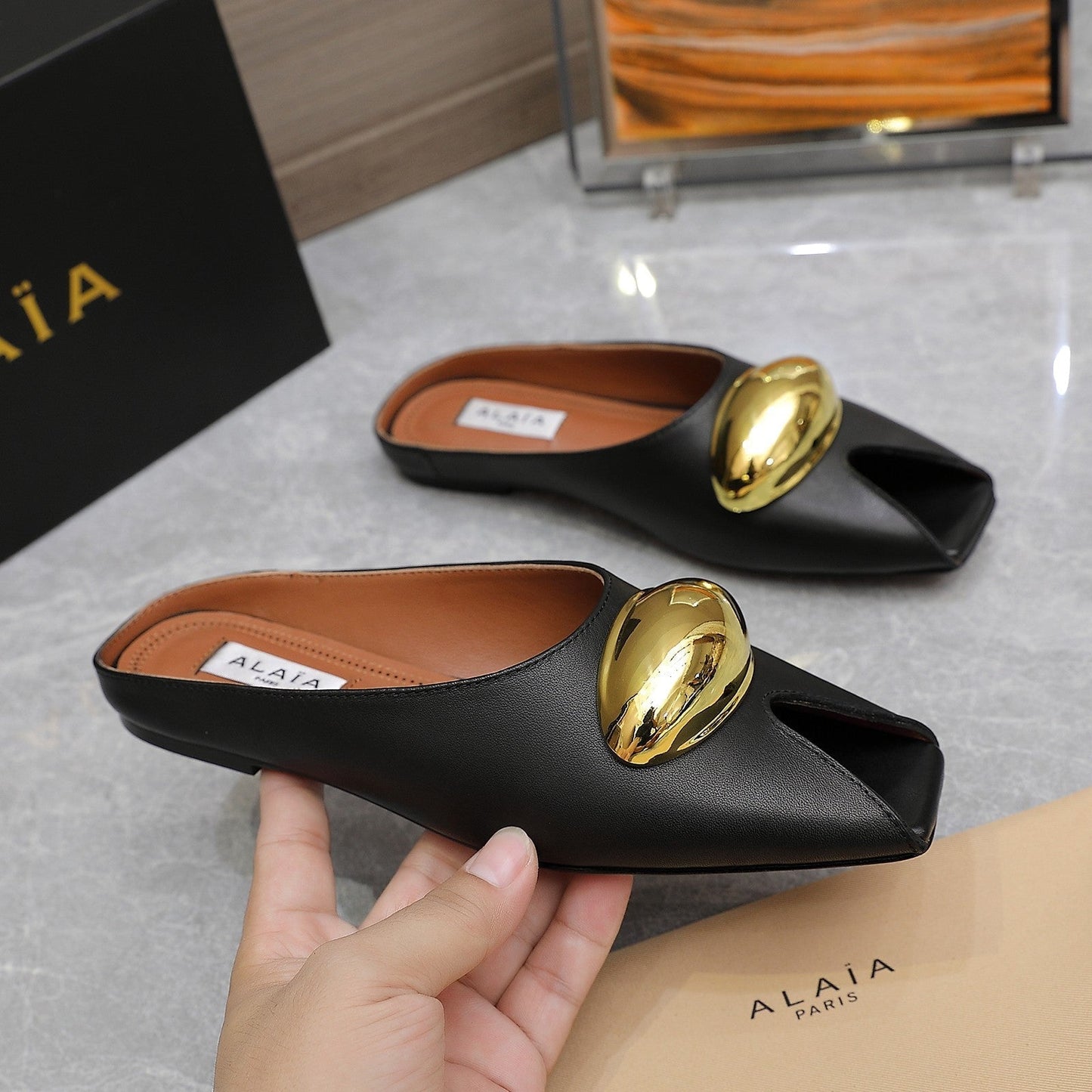 ALAIA FLAT MULE IN BLACK LAMBSKIN WITH GOLD HARDWARE - 34