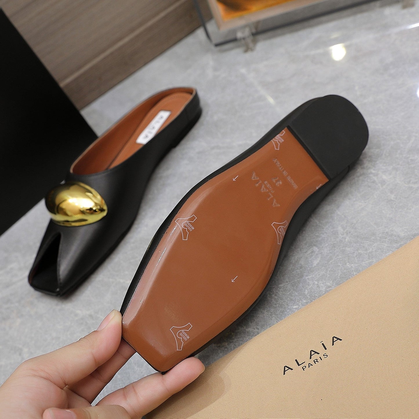 ALAIA FLAT MULE IN BLACK LAMBSKIN WITH GOLD HARDWARE - 34