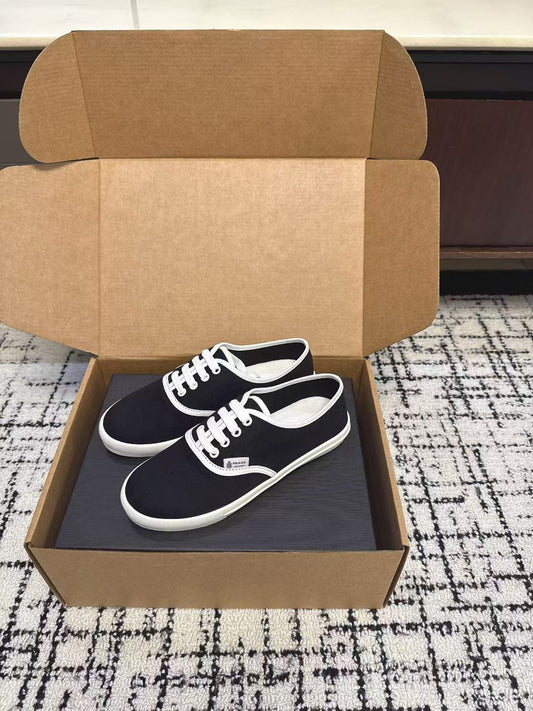 PRADA 26S LACE UP SNEAKERS IN BLACK AND WHITE CANVAS