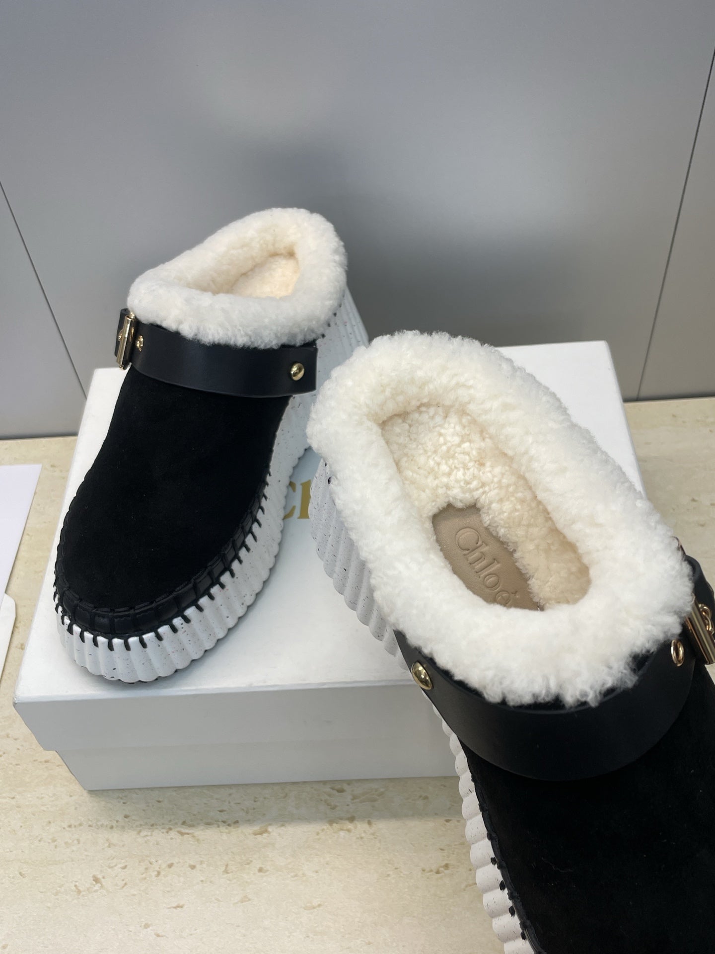 CHLOÉ 26S FUR-LINED WEDGE MULES IN BLACK SUEDE