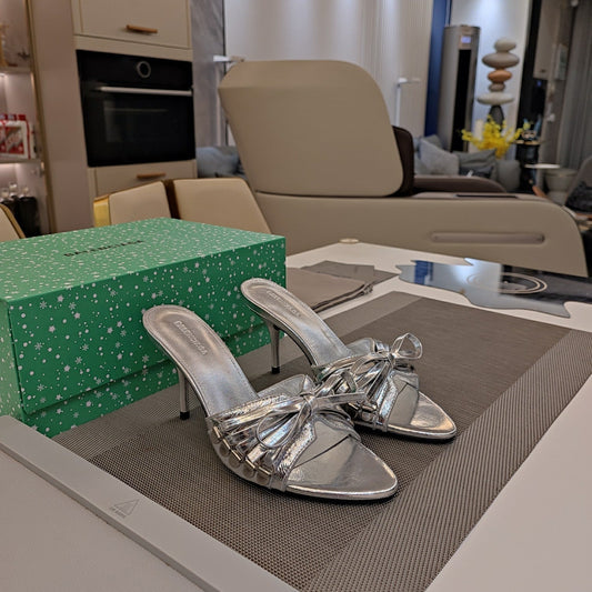 BOW-EMBELLISHED HIGH MULES IN SILVER METALLIC SHEEPSKIN - 34