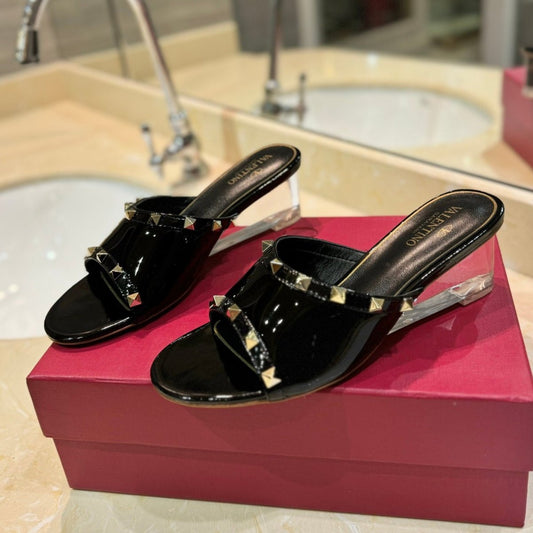 ROCKSTUD MULE SANDALS WITH TRANSPARENT HEEL IN BLACK CALFSKIN - 34
