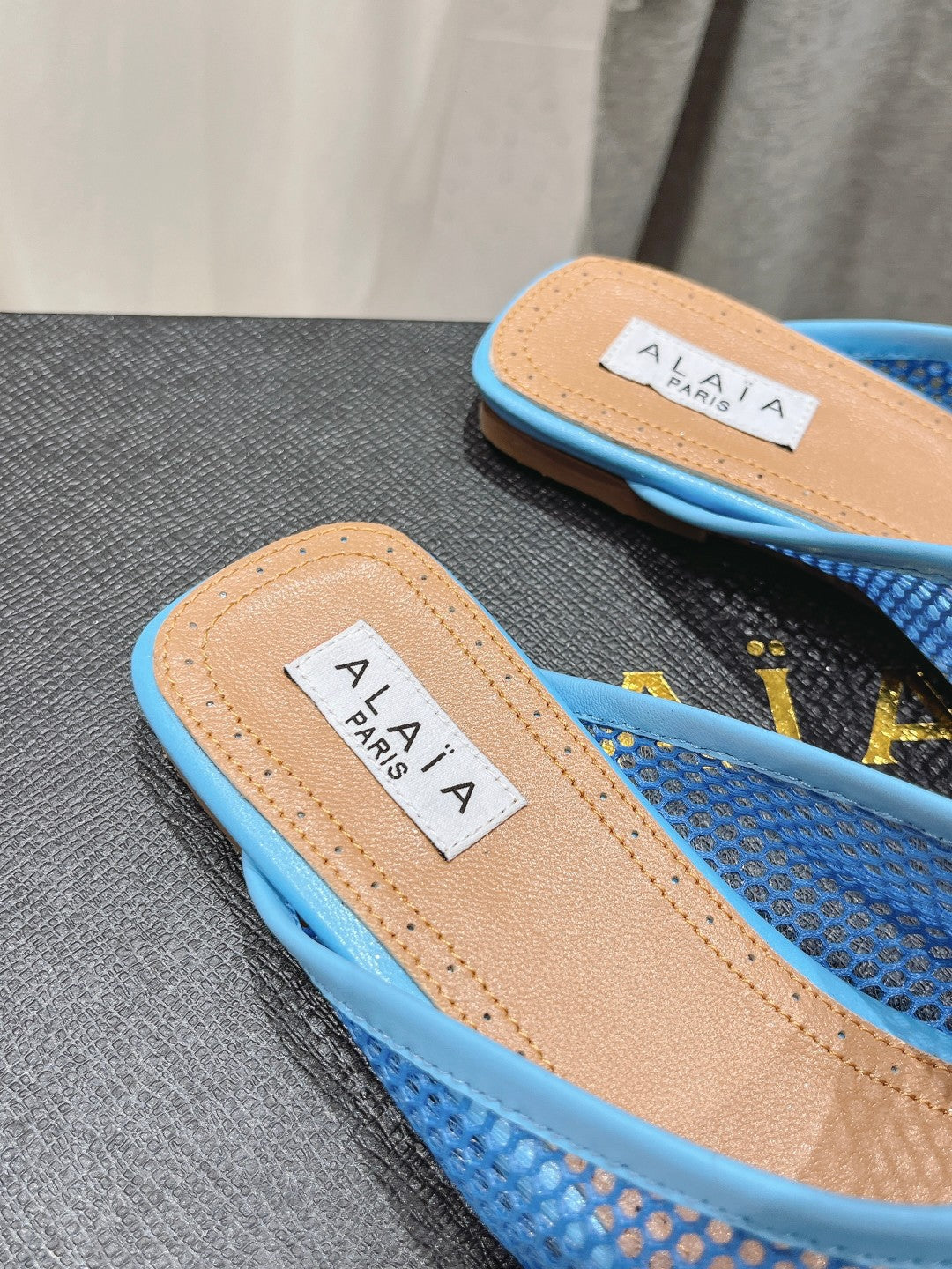 ALAIA FLAT MULES IN CERULEAN BLUE MESH FISHNET - 34