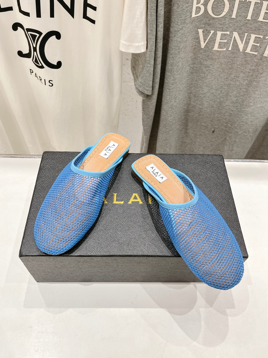 ALAIA FLAT MULES IN CERULEAN BLUE MESH FISHNET - 34