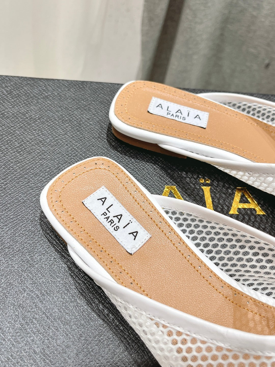 ALAIA FLAT MULES IN WHITE MESH FISHNET - 34
